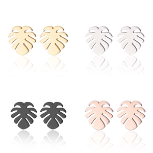 Detailed view of monstera leaf stud earrings in gold, silver, black, and rose gold finishes