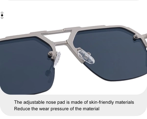 Detail of adjustable transparent nose pads on grey metal semi-rimless sunglasses