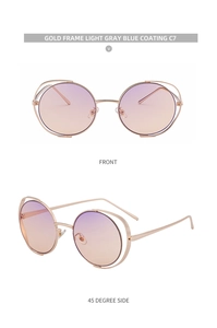 Detail of round gold metal sunglasses featuring purple to orange gradient lenses