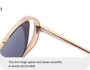 Détail de la charnière métallique robuste sur les lunettes de soleil carrées dorées