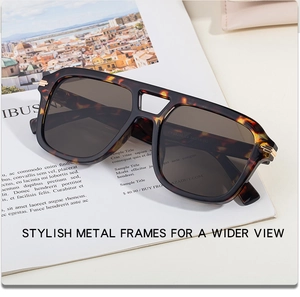 Detailed macro of tortoise shell sunglasses frames with golden metallic accents and hinges