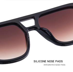 Detail of integrated silicone nose pads on black square frame sunglasses with gradient lens
