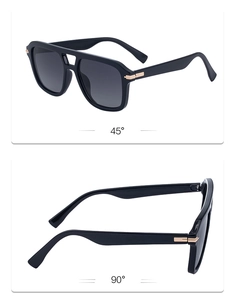Detail view showing 45 and 90 degree angles of black aviator sunglasses with gold hardware
