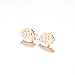 Detailed view of gold minimalist hollow hedgehog stud earrings in polished stainless steel