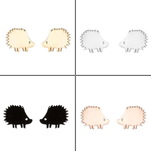 Detailed close-up showing hedgehog stud earrings in gold, silver, black and rose gold finishes