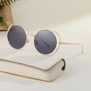 Women's hollow round metal frame sunglasses in gold with premium white hard case
