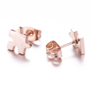 Minimalist puzzle-shaped rose gold stainless steel stud earrings on white background