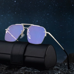 Modern semi-rimless aviator sunglasses with purple reflective lenses on a premium leather case