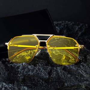 Retro pilot style semi-rimless sunglasses with gold metal frame and yellow resin lenses