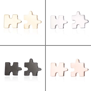 Asymmetric puzzle piece stud earrings set in gold, silver, black and rose gold finishes