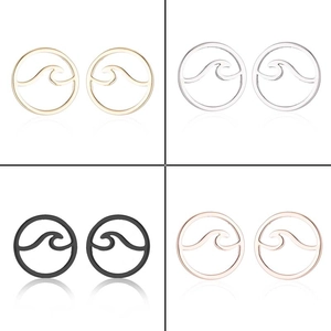 Detail view of hollow wave pattern stud earrings in gold silver black and rose gold finishes