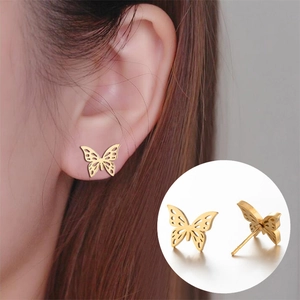 Golden hollow butterfly stud earrings in stainless steel with detailed wing patterns