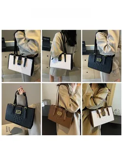 Detail of crocodile pattern shoulder bags with adjustable metal buckles in multiple colors