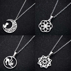 Set of four stainless steel necklaces with geometric moon cat and floral pendants