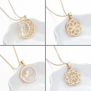 Four minimalist gold hollow pendant necklaces featuring moon cat and mandala floral designs