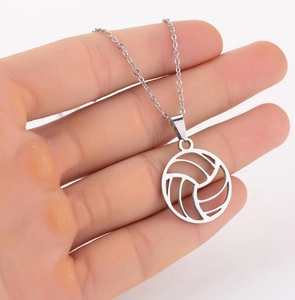 Detailed close-up of a silver hollow volleyball pendant on a stainless steel chain link