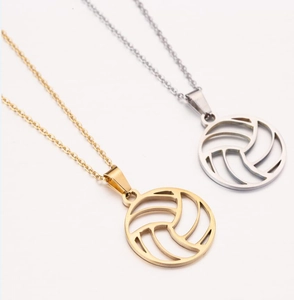 Detailed view of gold and silver hollow volleyball pendants with fine link chains