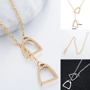 Macro detail of U-shaped horseshoe pendant with 13mm dimensions in gold and silver finish