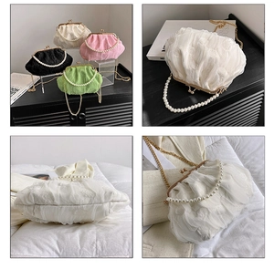 Detail showing lace cloud bags with pearl handles and metal clasps in four colors