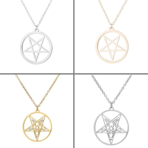 Close-up of gothic pentagram and Baphomet skull pendants in gold and silver finishes
