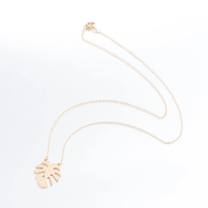 Elegant gold monstera leaf pendant necklace in polished stainless steel for women