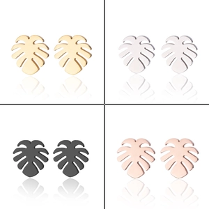 Detail of monstera leaf earrings in gold, silver, black, and rose gold finishes