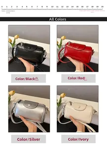 Detailansicht der Mini-Zylindertasche in Schwarz, Rot, Silber und Beige mit Struktur