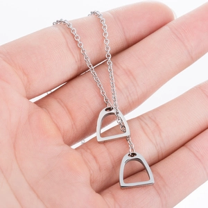 Minimalist silver stainless steel horseshoe stirrup necklace on a delicate fine link chain