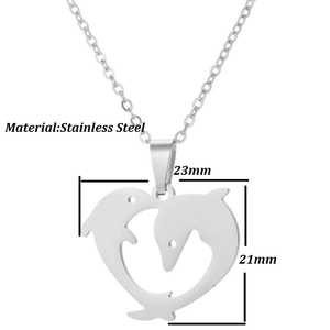 Detailed view of hollow heart and double dolphin stainless steel pendant, 23mm size