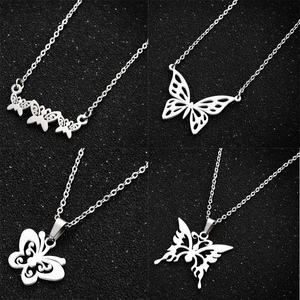 Set of four minimalist stainless steel butterfly pendant necklaces with silver finish