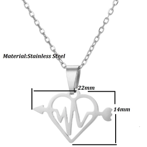 Macro detail of stainless steel heart pendant with arrow design, 22mm by 14mm size