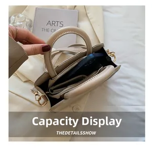 Top view of beige leather crossbody bag interior showing spacious daily essentials storage