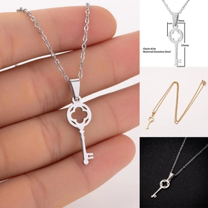 Detailed view of hollow clover key pendant in stainless steel with exact measurements