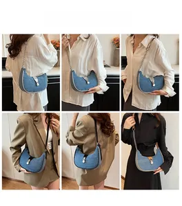 Detail shots of denim baguette bag featuring silver chain strap and metal buckle closure
