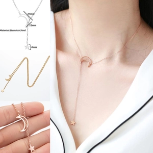 Detailed view of moon and star stainless steel necklace with size specifications