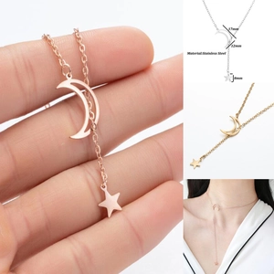Minimalist stainless steel moon and star tassel necklace available in gold and rose gold