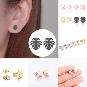 Detailed views of monstera leaf stud earrings in silver, gold, rose gold and black steel