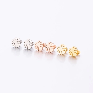 Detailed view of monstera leaf stud earrings in silver, rose gold, and gold plated finishes