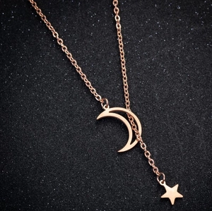 Elegant rose gold star and moon necklace with hollow crescent and solid star charms
