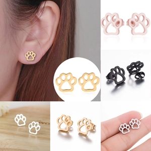 Detailed views of hollow paw print earrings in gold, silver, rose gold and black finish