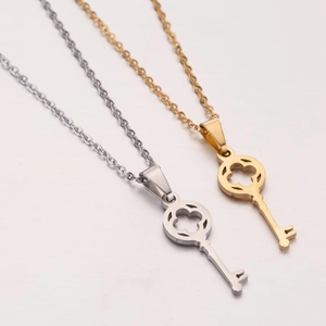 Minimalist stainless steel key necklace with hollow clover pattern in gold and silver