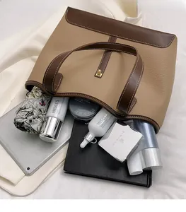 Detail shot showing the large interior capacity of this two-tone tote bag for women