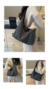 Detailed view of grey canvas tote bag with black polka dots and small bow patterns