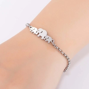 Minimalist silver stainless steel elephant bracelet with three polished charms on a fine chain