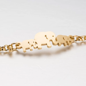 Minimalist stainless steel golden elephant chain bracelet with trio design on white background