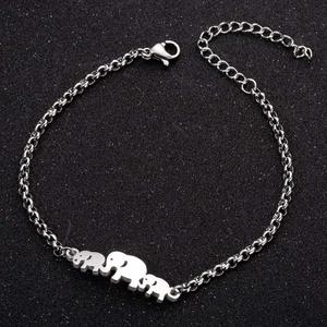 Detail view of silver-tone chain bracelet with three elephant charms and adjustable lobster clasp