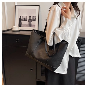 Minimalist black lychee texture leather tote bag featuring a spacious interior for work