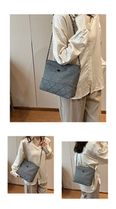 Detail of grey quilted nylon shoulder bag featuring silver chain and triangular logo