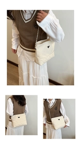 Three-way view of a cream nylon shoulder bag with triangle logo and chain strap