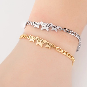Detail of elegant stainless steel bracelet with golden and silver hollow butterfly pendants